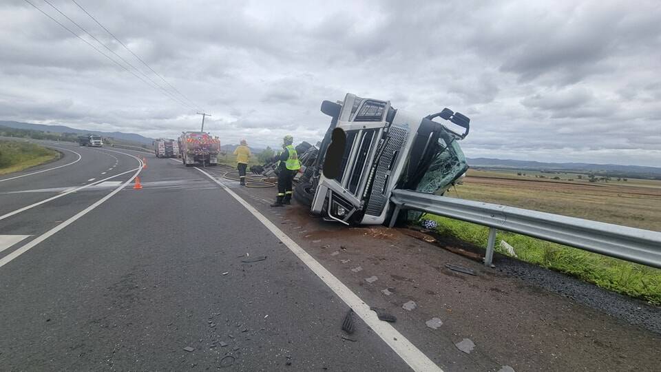 The driver had a lucky escape after this B-double truck rolled on the Golden Highway. Picture by Fire and Rescue Denman