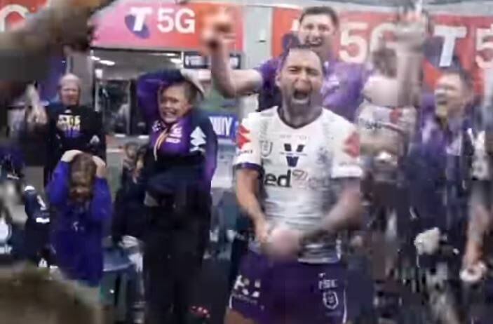 JUBILATION: Inside the Storm dressing room and Cameron Smith leads the celebration.