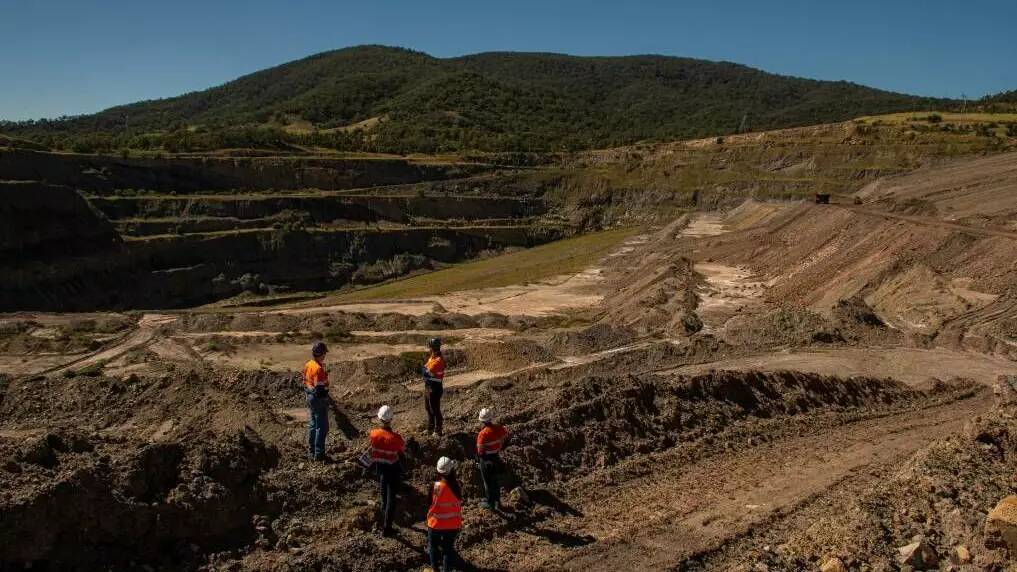 The Muswellbrook Pumped Hydro project team overlooking the mining void at Bells Mountain. Picture by Simon McCarthy.