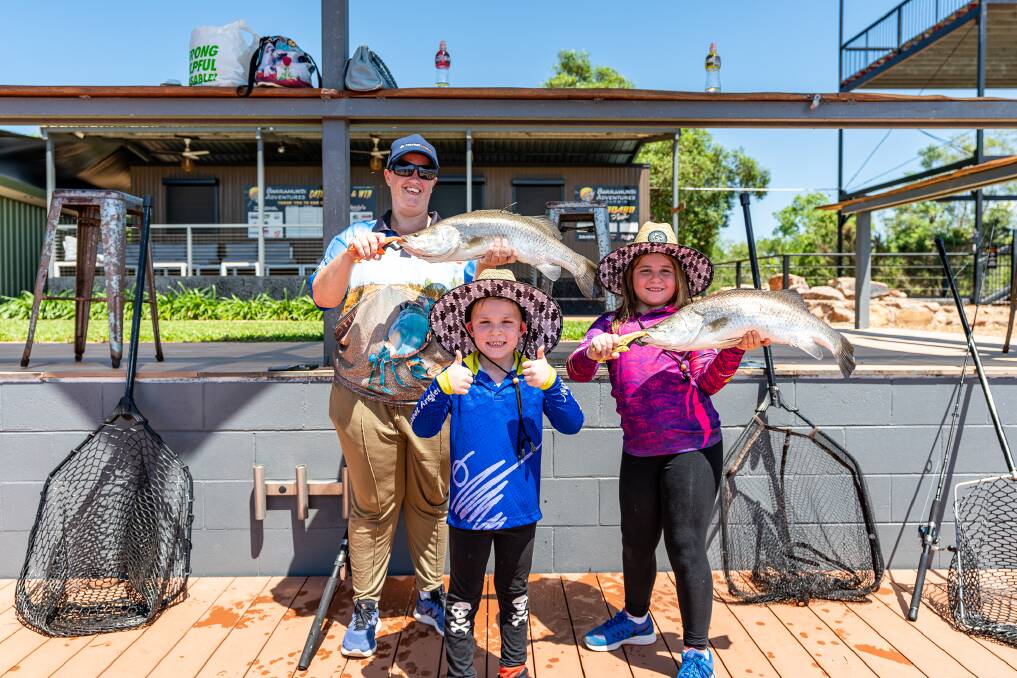 Successful fishers Emma Jolley and Chase and Addison Bradbury (L-R) at Barramundi Adventures. Picture: Michael Turtle