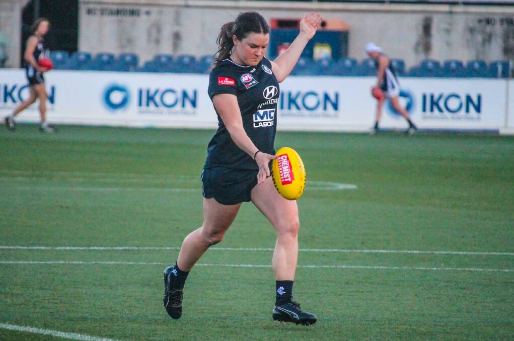 DRIVEN: Webb looks to drive her right boot into a kick at Ikon Park during a brief AFLW stint. Picture: Carlton Media