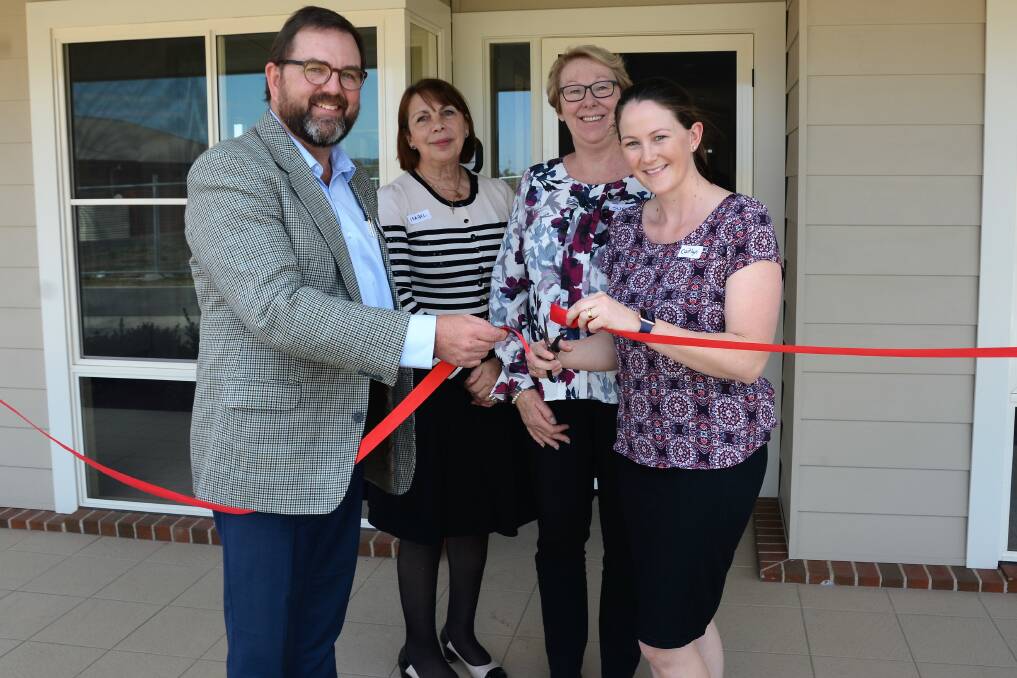 DOORS OPEN: General Manager for HammondAtHome, David Martin and village manager Caitlyn Easey cut the ribbon for the opening of the new community centre at the Strathearn Villas with representative of Strathearn Isabel and Sue.
