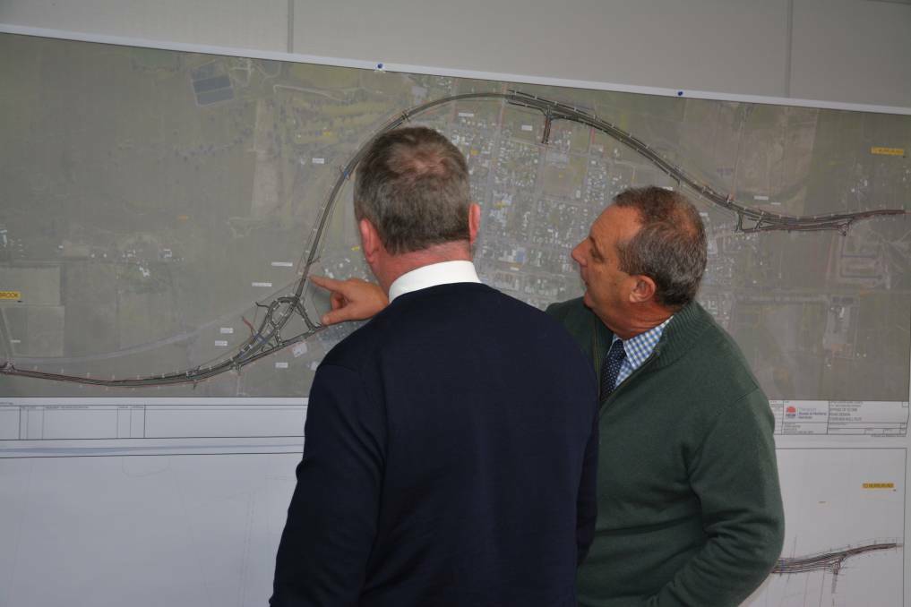 New England MP Barnaby Joyce and Upper Hunter MP Michael Johnsen view a map of the Scone bypass earlier in the year.