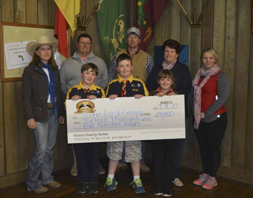 GIVING BACK: Jessica Norton, Scone Charity Rodeo Secretary, Glen Tarrant, Scone Thoroughbreds Rugby League, Jade Smith, Scone Charity Rodeo President, Erryn Day, Scone Scouts Treasurer, Rachelle Baldwin, Scone & District Pre-school, Ryan Davidson, Cooper Day and Felicity Davidson with the Scone Scouts.