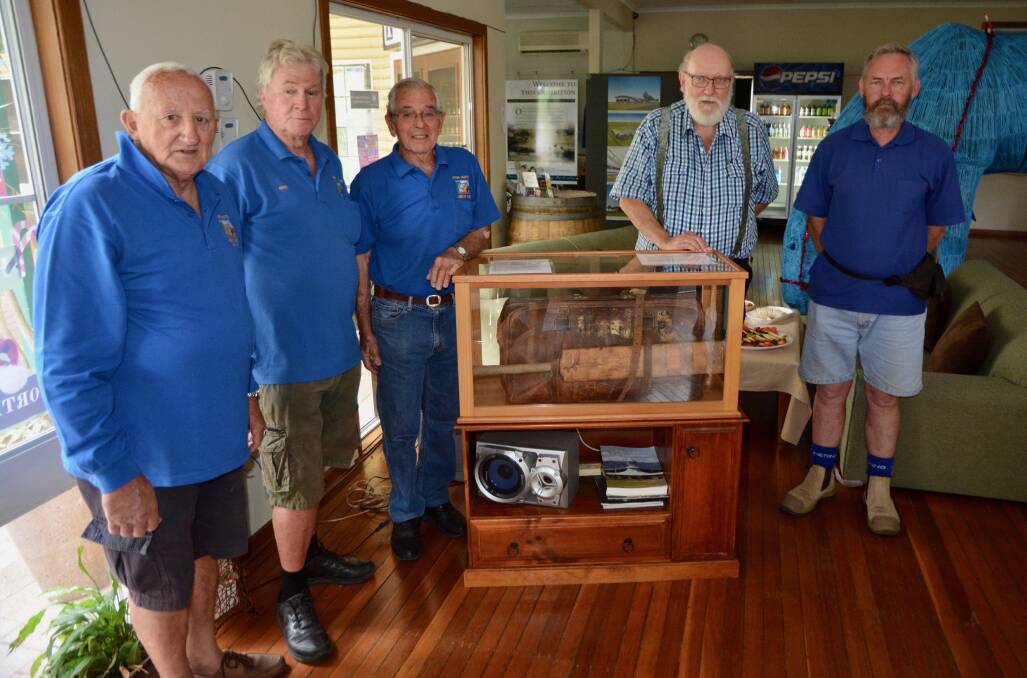 Upper Hunter Men's Shed members David Spencer, David Newling and John Pratley with Historical Society members Robert Thurgood and Eddie Mason and Henry 'Tup' Scott's cricket gear which is now on display at the Scone Visitor Information Centre. 