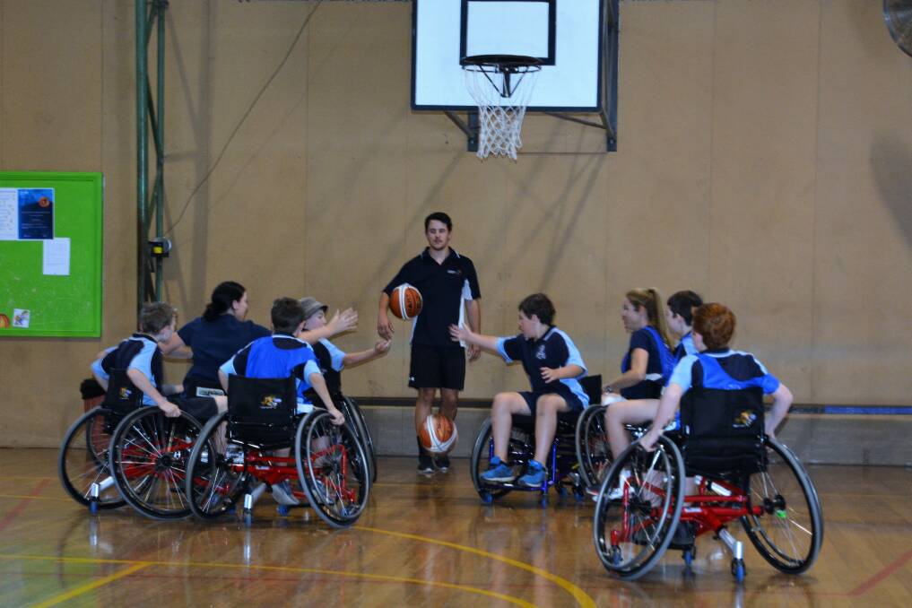 ROLL ON: Scone Public School students experienced basketball on wheels during one of the sessions at the Scone Basketball Stadium on Monday.