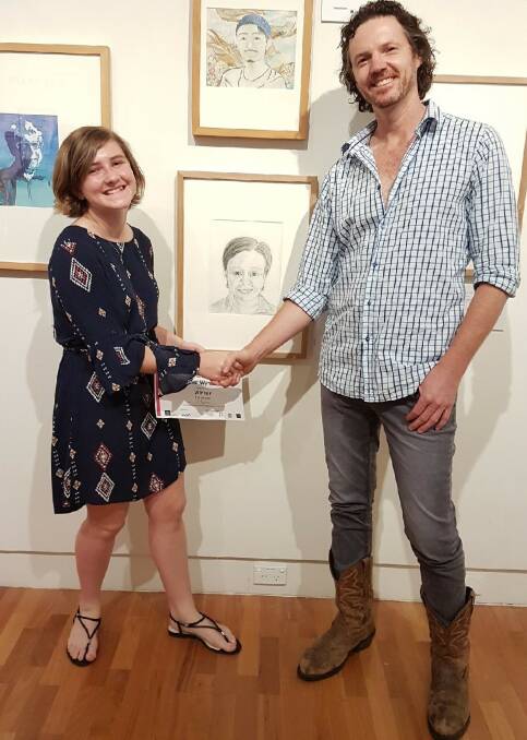 CONGRATULATIONS: Eleanor Wyndham being presented her award by Murrurundi artist and Archibald Prize finalist David Darcy.