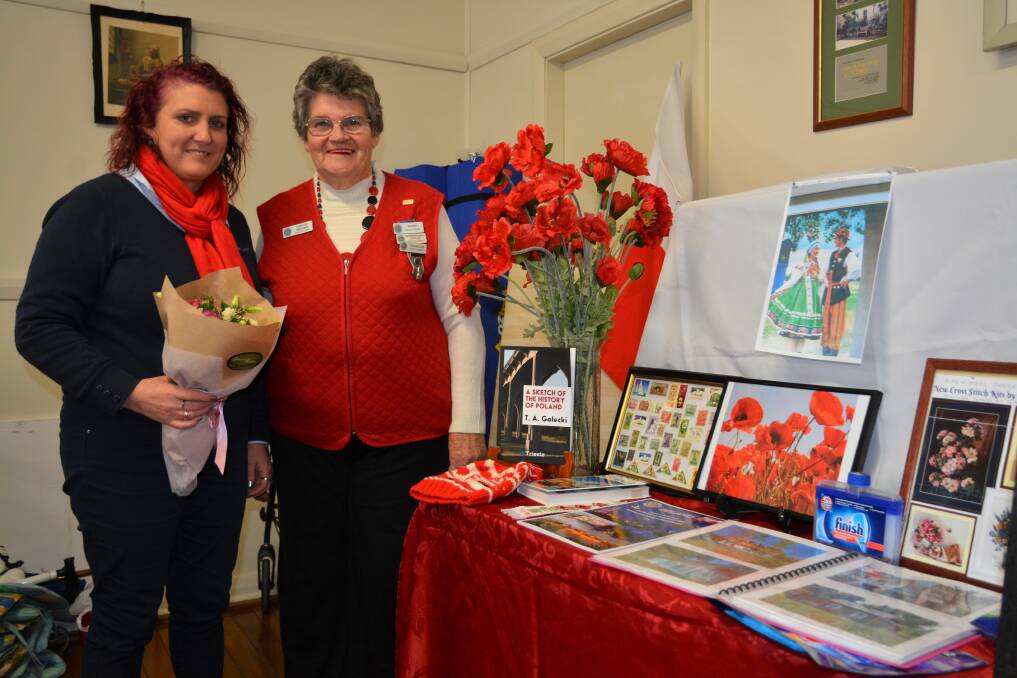 ALL THINGS POLISH: Guest Speaker Racheal McGuirk, Helloworld Travel Scone with Scone Country Women’s Association international officer Lorraine Gardiner and the Polish display assembled by the CWA.