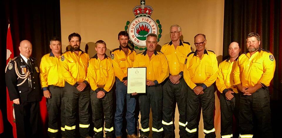 LOCAL FIREFIGHTERS: Commissioner Shane Fitzsimmons (left) with local firefighters who recently received the Commissioner's Certificate of Commendation (unit) at a presentation in Sydney. Photo: Supplied