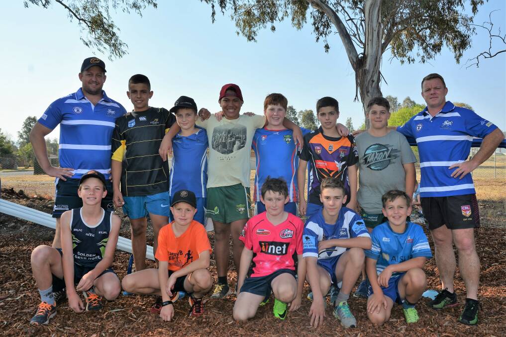 READY TO ROLL: Scone Thoroughbreds Rugby League Club's new president Tom Hagan and first grade coach Aaron Watts with some juniors on Tuesday.