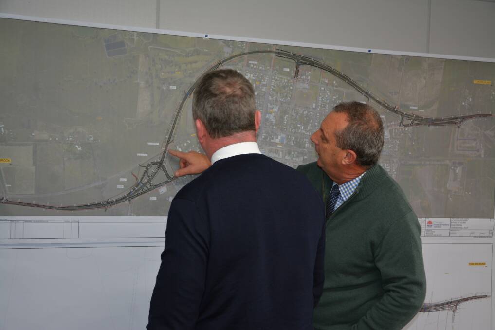 MAP: New England MP Barnaby Joyce and Upper Hunter MP Michael Johnsen view a map of the Scone bypass on Wednesday.