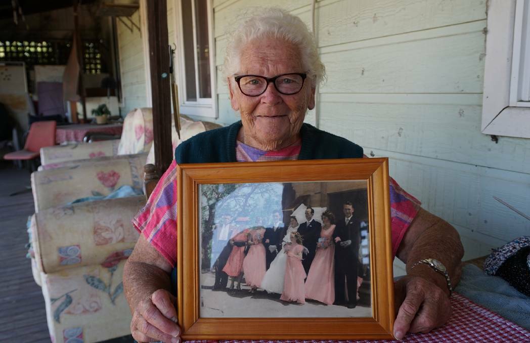 Merriwa's Eva Towler holding her wedding photo in February 2018, after celebrating her 60th wedding anniversary with partner Mick Towler.