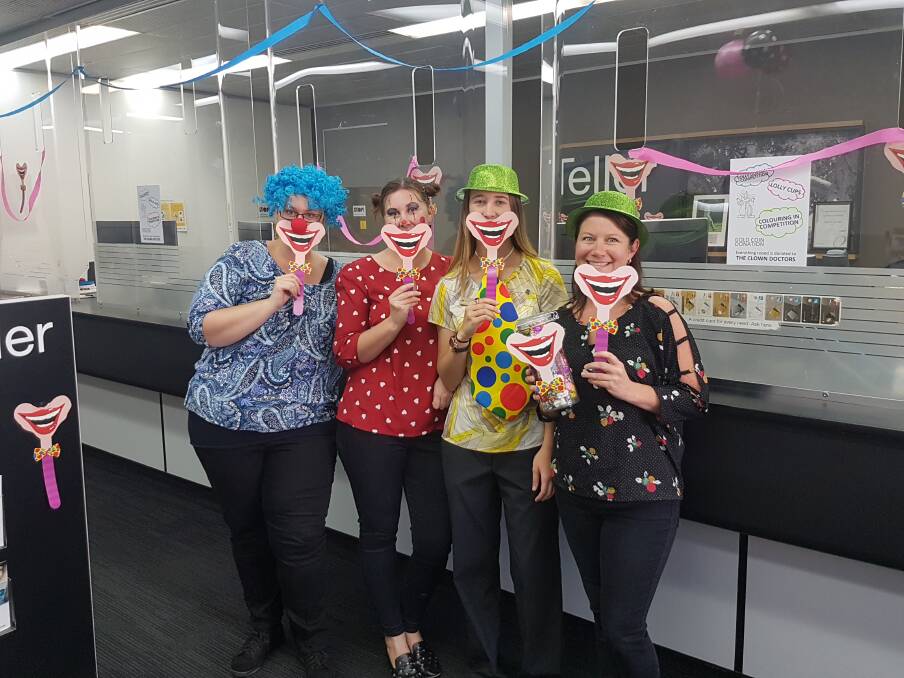 FUN FOR FUNDS: Scone Commonwealth Bank branch employees dress up in support of Clown Doctors. 