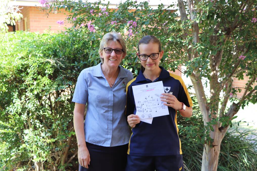 The winning logo for the 2019 Kia-Ora Youth Music Camp came from Ruby Hyland who, when entering the competition, was in year six at Blandford Public School, pictured with Upper Hunter Shire Council’s Community Services Officer, Amanda Catzikiris.