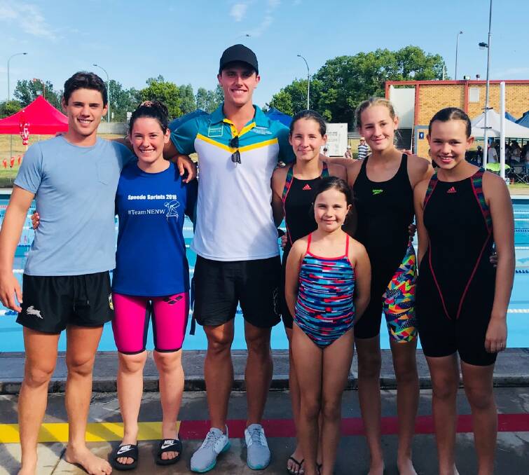 Sam Avard, Annabelle Avard, Elinor and Charlotte Brooks, Ruby Hyland and Olive Hyland at the Tamworth City two day swim carnival in January where the kids met current Australian Dolphin team member and Olympic competitor Kurt Herzog (middle).  Photo: Supplied