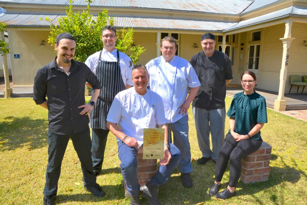WINNING TEAM: A few members of the Cottage Scone team: Alejandro Rodriguez, Nicolas Evans, Dominick Whitney, Tony Powell, Rose Lopes and Colin Selwood with the award for NSW Regional Restaurant of the Year. 