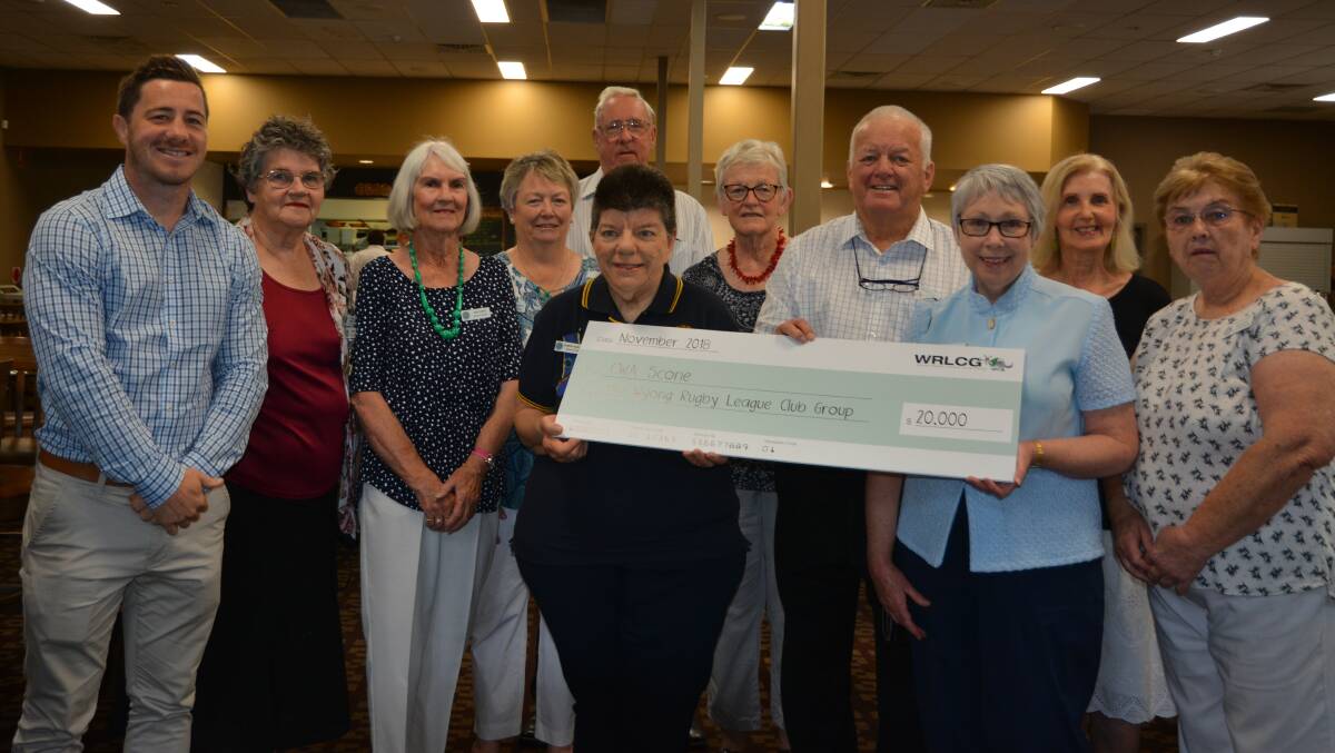 Scone & District Country Women's Association members with representatives of the of the Wyong Rugby League Club Group on Wednesday after recieving a $20,000 donation.