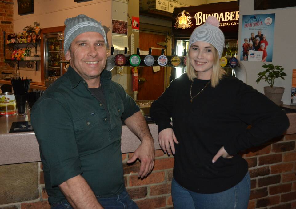 BEANIES ON: The Belmore Hotel's Andrew Kelaher and Tennille Crisp have their beanies on as they warm up for their Mark Hughes Foundation Winter Beanie Party this Saturday.