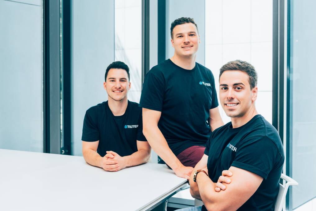 TRANSFORMATIVE TECH: Former Scone High School duo Chris Sampson (left) and Martin Karafilis (right) along with Marcel Herz are co-founders of self-checkout tech firm Tiliter Technology. Photo: Supplied 