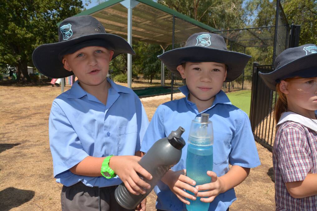 Murrurundi Public School students Corbin and Jacob were pleased with the cool water in their bottles from the panels.