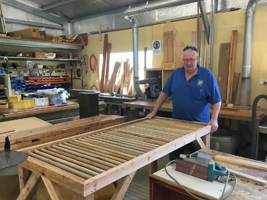 Leo van de berg from the Upper Hunter Men's Shed who made the table with George Clemenson.