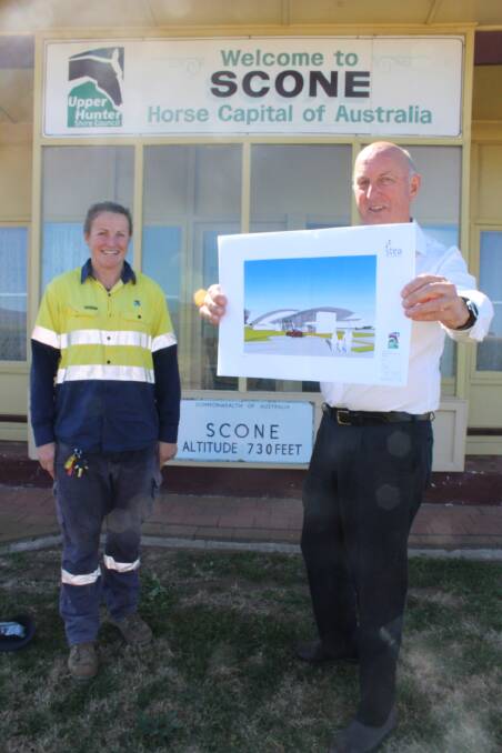 COME BUILD IT: Scone Airport Reporting Officer Kate Brown and Manager Special Projects Alan Fletcher, with some of the conceptual plans for the airport and new visitor attraction. 