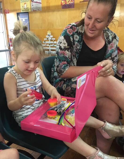 KINDER READY: Audrey opening her activity box provided by Scone Rotary, at the Scone Public School Kinder orientation day last Wednesday. 
