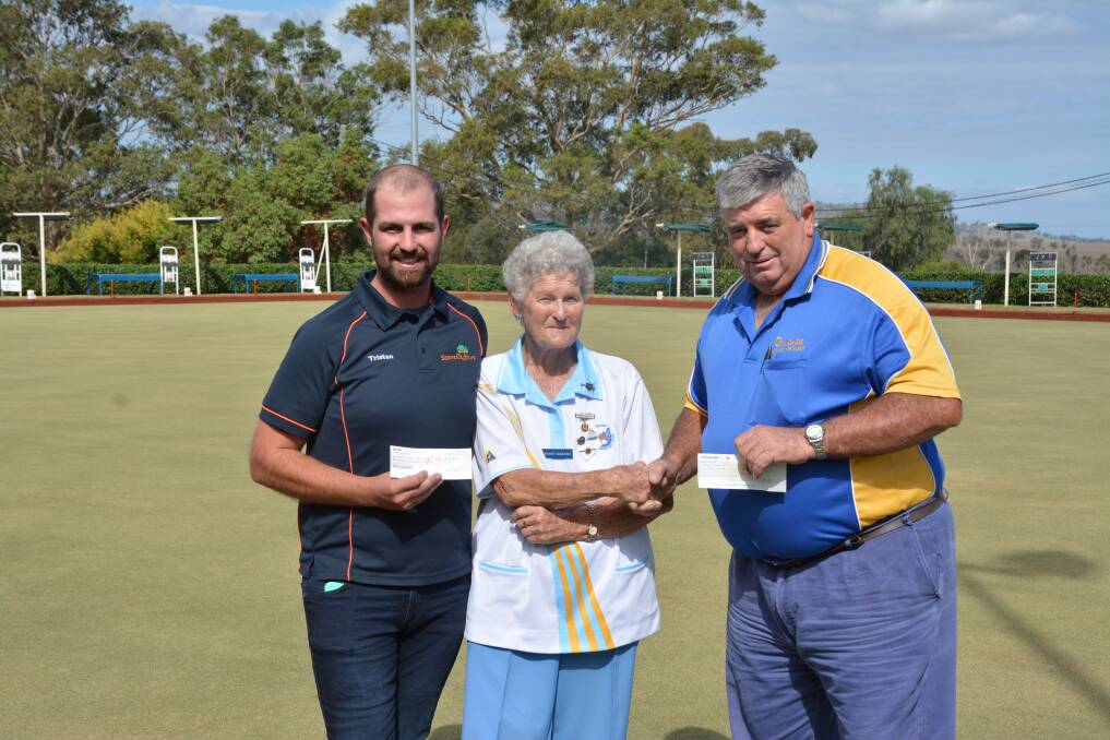 SUPPORT: Tristan Wells, Scone Outdoors and Robert Osmond, Osmonds Pumps + Water Solutions both present $300 cheques to Scone Women's Bowling Club president Wendy McKenzie.