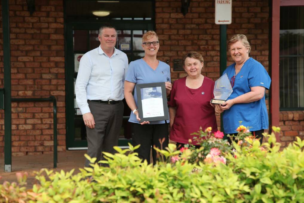 PROUD: Waid Crockett, Julie Wilton, Suzanne Duggan and Janine Coombes proudly display Gummun Place Hostel’s Prime Super Employer Excellence in Aged Care Award.