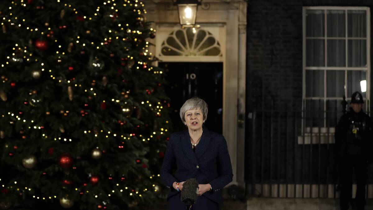 Still leader: Britain's Prime Minister Theresa May delivers a speech outside 10 Downing Street in London on Wednesday after surviving a no-confidence vote by Tory MPs. Photo: Matt Dunham
