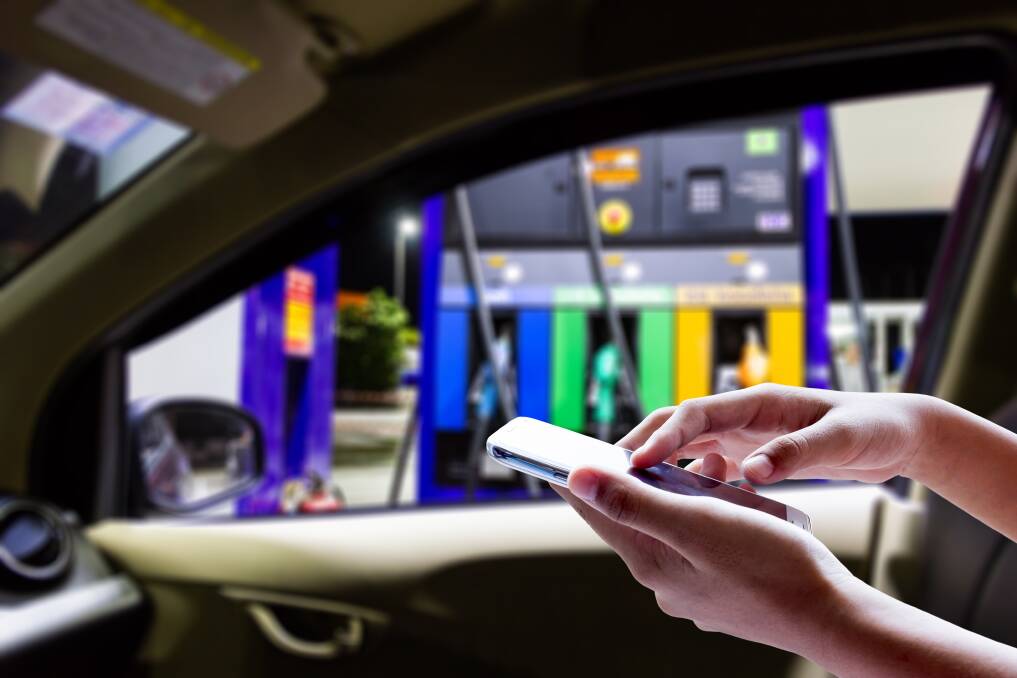 The Australian Transport Safety Bureau warns that mobile phones can lead to driver distraction during refuelling. Picture: Shutterstock