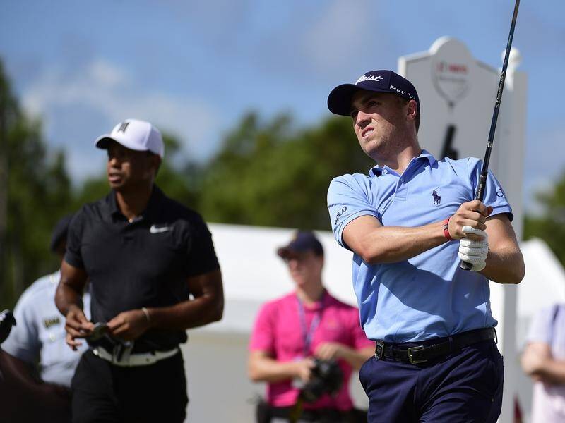 Justin Thomas (r) is used to late night texts from his Presidents Cup captain Tiger Woods (l).
