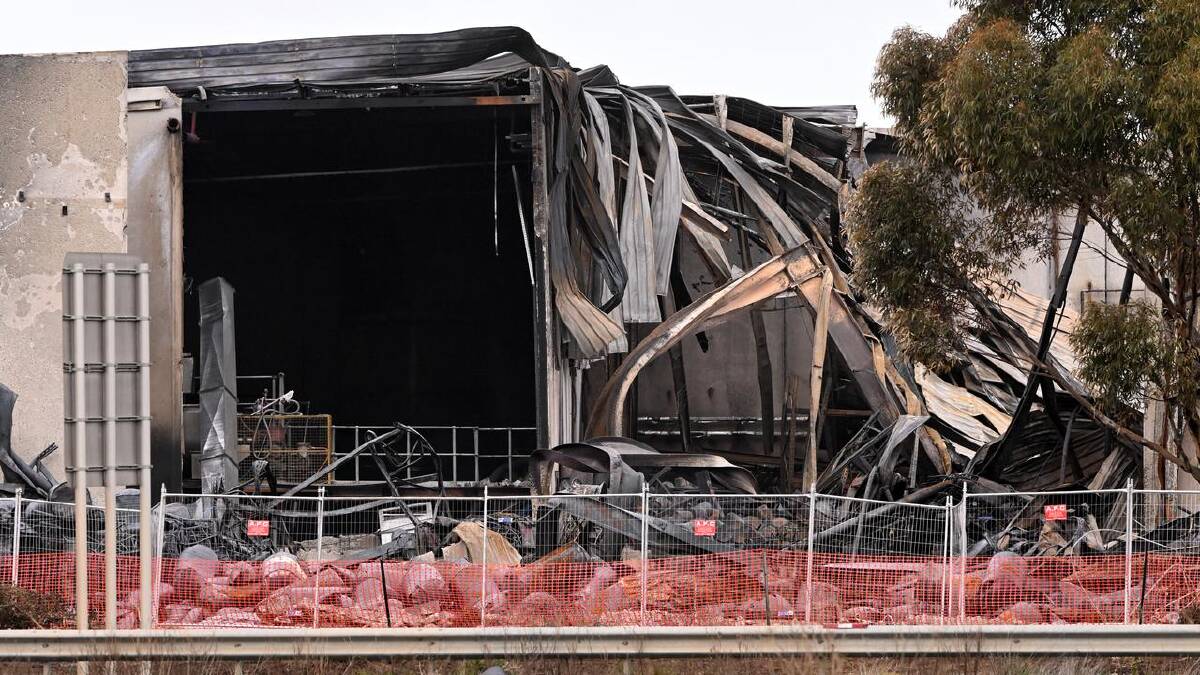 The inferno led to explosions that sent chemical drums flying into the air.  (James Ross/AAP PHOTOS)