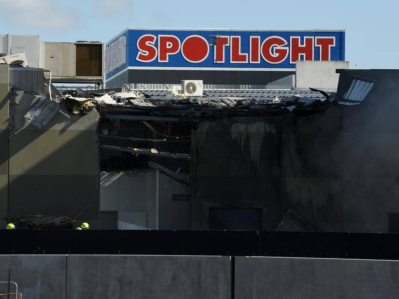 Five people died when a light plane crashed into a Melbourne factory outlet.