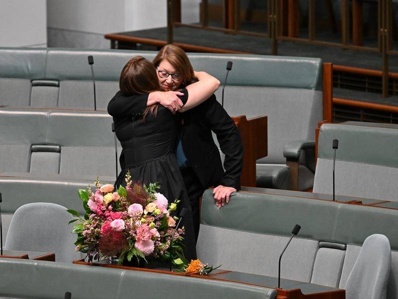 Flowers have been placed on Peta Murphy's seat in parliament following her death at 50. (Lukas Coch/AAP PHOTOS)