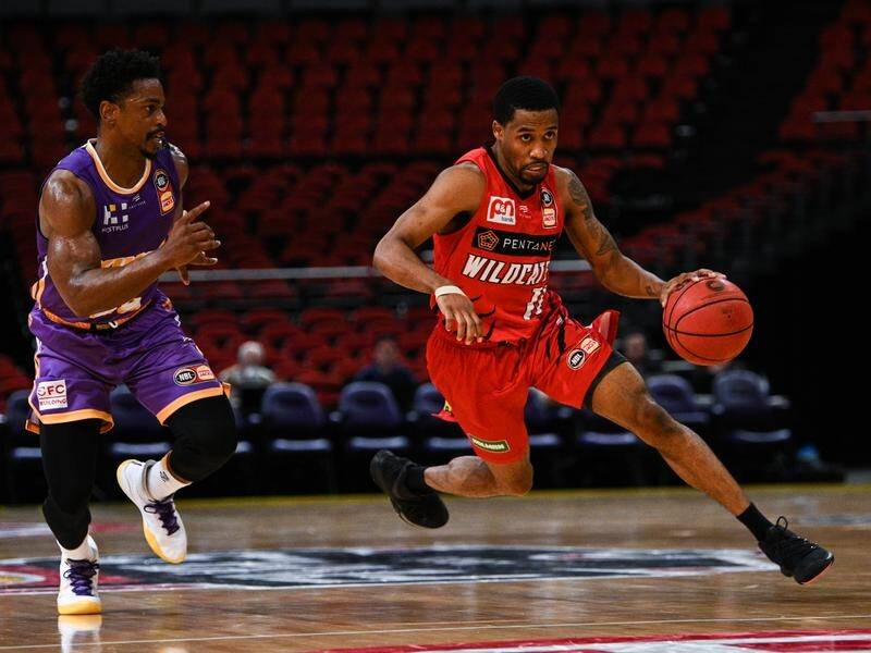 Bryce Cotton (r) has returned to NBL champions Perth Wildcats for three more seasons.