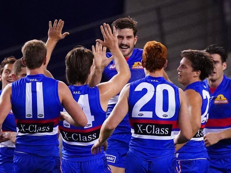 Josh Bruce (centre) kicked six goals as the Western Bulldogs thrashed North Melbourne by 49 points.