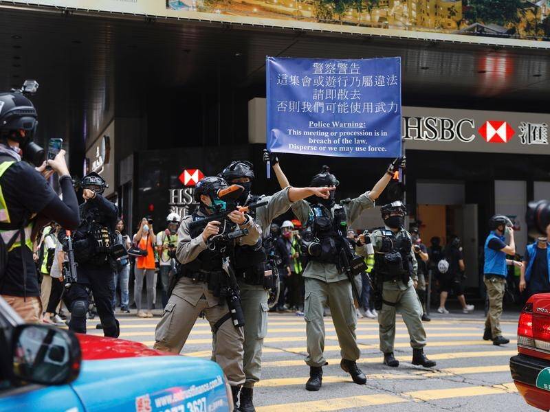 Hong Kong police have fired pepper pellets at protesters.