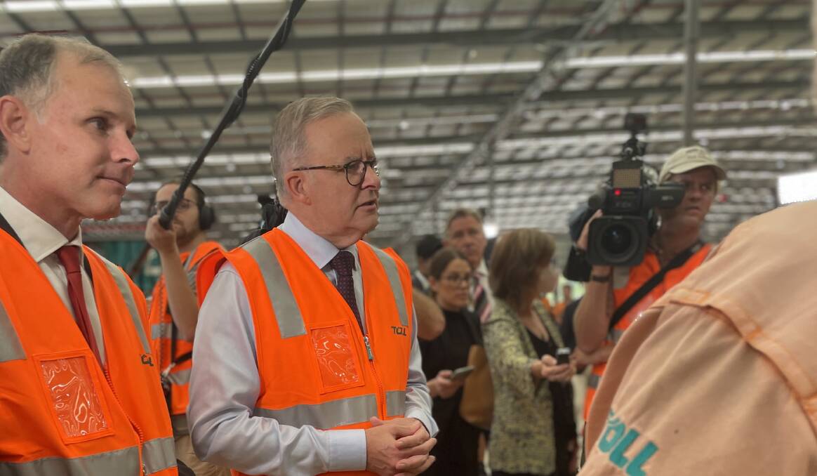 Mr Albanese speaks with workers at the Toll plant outside Brisbane. Picture: Dan Jervis-Bardy